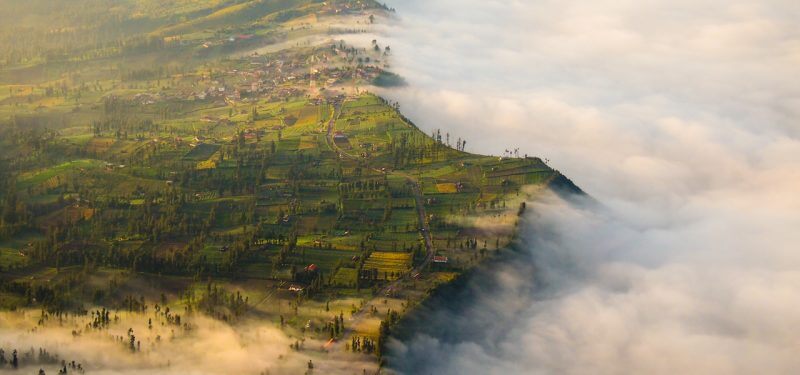 Clouds spilling over cliff