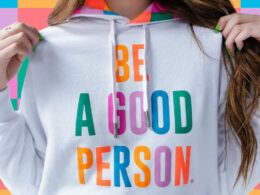 Image of a girl wearing a "Be A Good Person" hoodie