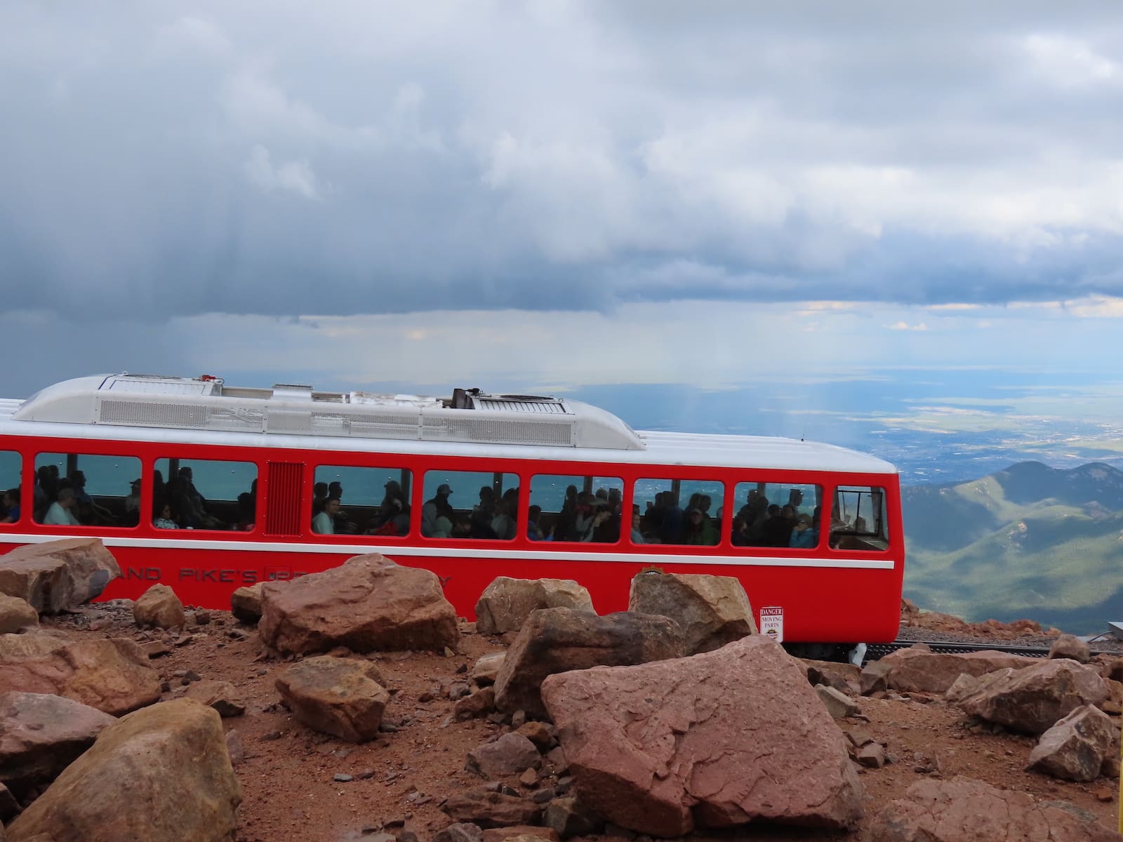 Pikes Peak Cog Railway train and view from Pikes Peak