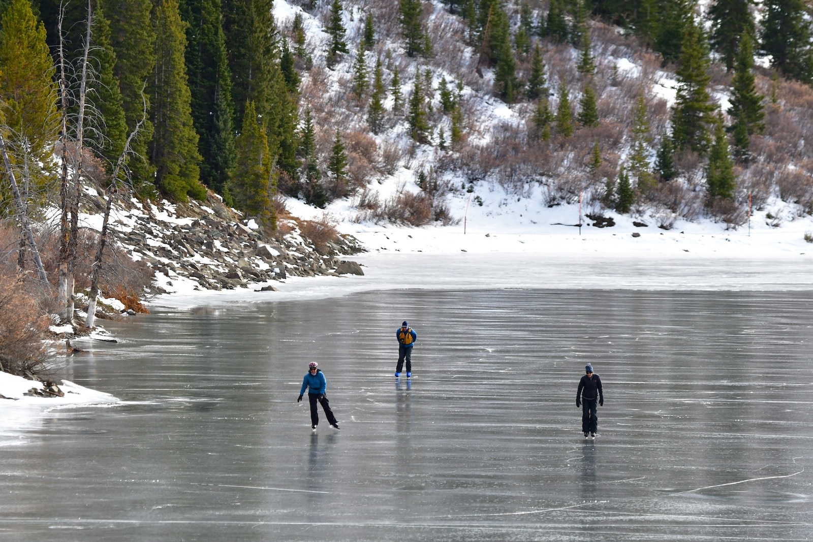 Winter Ice Skaters on Mirror Lake in Tincup, Colorado 