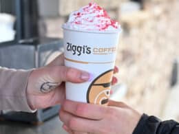 Image of a person getting a coffee in the drive thru of Ziggi's Coffee